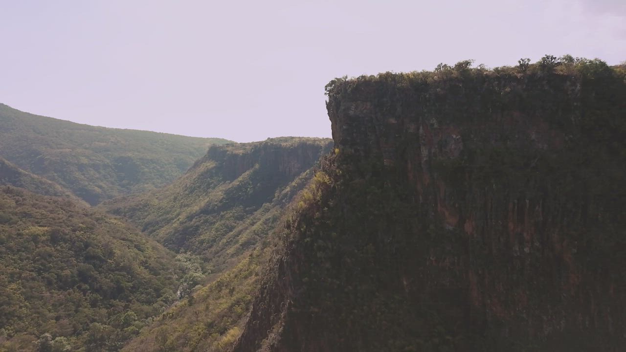 A quiet valley between steep cliffs